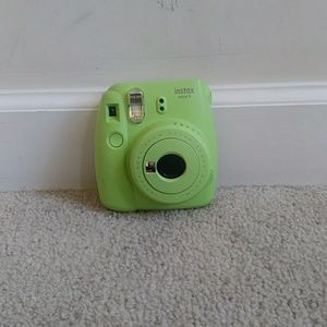 Lime green fujifilm instax mini 9 polaroid camera